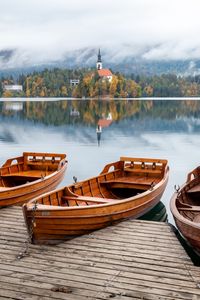 Preview wallpaper boat, lake, trees, buildings, reflection