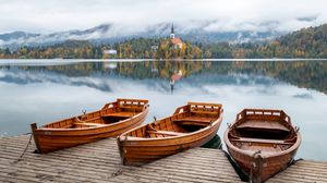Preview wallpaper boat, lake, trees, buildings, reflection