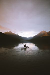 Preview wallpaper boat, loneliness, rocks, paddle, silhouette