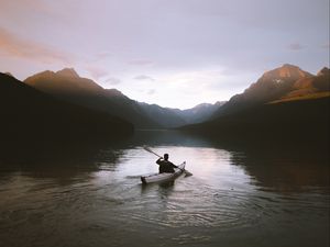 Preview wallpaper boat, loneliness, rocks, paddle, silhouette