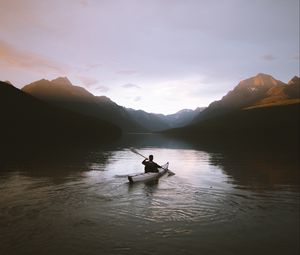 Preview wallpaper boat, loneliness, rocks, paddle, silhouette