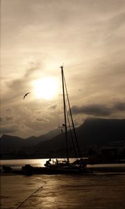 Preview wallpaper boat, mast, lake, mountains, dark