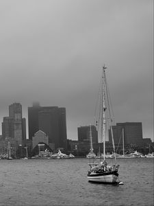 Preview wallpaper boat, mast, sea, buildings, city, black and white