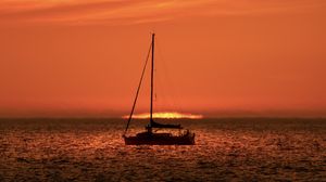 Preview wallpaper boat, mast, sea, sunset, dark