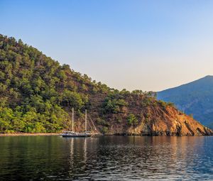 Preview wallpaper boat, masts, lake, hill, trees