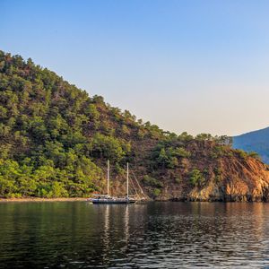 Preview wallpaper boat, masts, lake, hill, trees