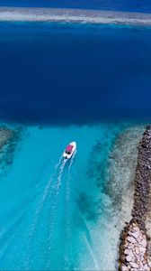 Preview wallpaper boat, ocean, stones, aerial view