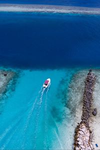 Preview wallpaper boat, ocean, stones, aerial view