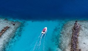 Preview wallpaper boat, ocean, stones, aerial view