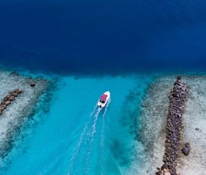 Preview wallpaper boat, ocean, stones, aerial view