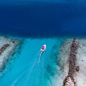 Preview wallpaper boat, ocean, stones, aerial view