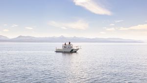 Preview wallpaper boat, people, sea, waves, mountains, sky