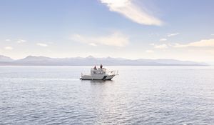 Preview wallpaper boat, people, sea, waves, mountains, sky