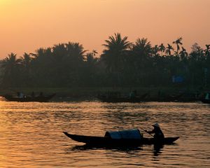 Preview wallpaper boat, person, asia, lake, coast, palm trees