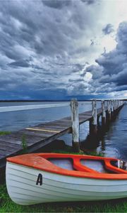 Preview wallpaper boat, pier, coast, reservoir, cloudy, evening