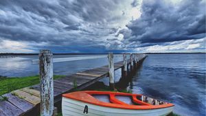 Preview wallpaper boat, pier, coast, reservoir, cloudy, evening