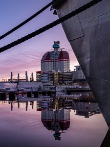 Preview wallpaper boat, pier, water, reflection, city, buildings, twilight