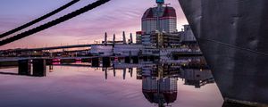 Preview wallpaper boat, pier, water, reflection, city, buildings, twilight