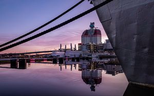 Preview wallpaper boat, pier, water, reflection, city, buildings, twilight