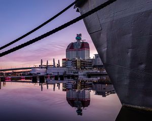 Preview wallpaper boat, pier, water, reflection, city, buildings, twilight