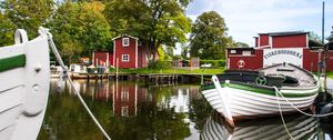 Preview wallpaper boat, river, buildings, trees