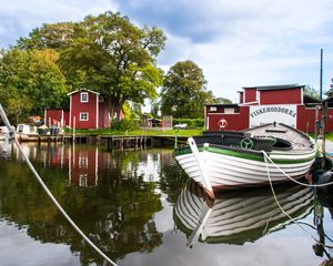 Preview wallpaper boat, river, buildings, trees