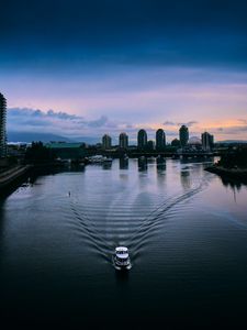 Preview wallpaper boat, river, city, buildings, skyscrapers