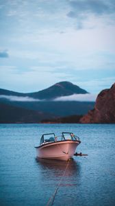 Preview wallpaper boat, rocks, sea, water