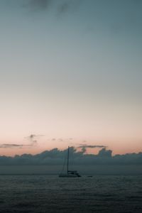 Preview wallpaper boat, sail, ocean, clouds, horizon, twilight