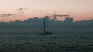 Preview wallpaper boat, sail, ocean, clouds, horizon, twilight