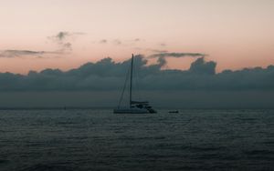 Preview wallpaper boat, sail, ocean, clouds, horizon, twilight