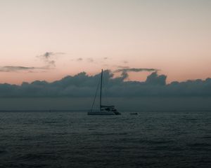 Preview wallpaper boat, sail, ocean, clouds, horizon, twilight