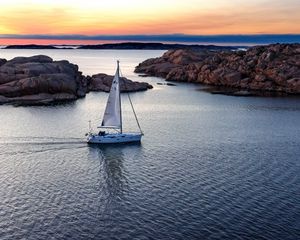 Preview wallpaper boat, sail, sea, stones, sunset, horizon