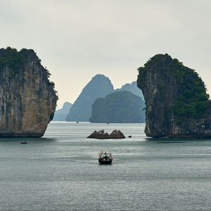 Preview wallpaper boat, sea, bay, rocks, mountains