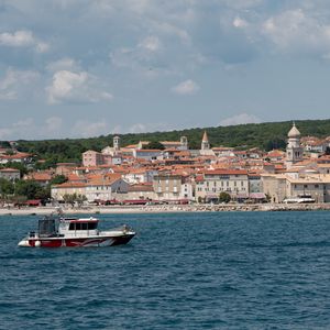 Preview wallpaper boat, sea, buildings, sky