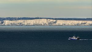 Preview wallpaper boat, sea, coast, cliff