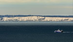 Preview wallpaper boat, sea, coast, cliff
