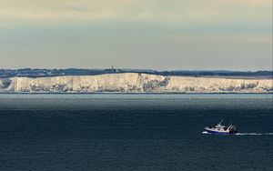 Preview wallpaper boat, sea, coast, cliff