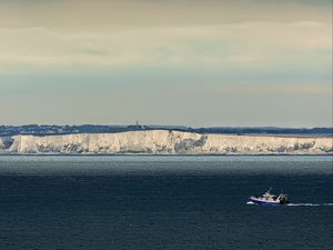 Preview wallpaper boat, sea, coast, cliff