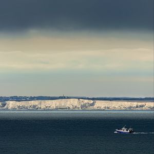 Preview wallpaper boat, sea, coast, cliff