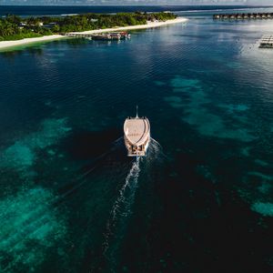 Preview wallpaper boat, sea, coast, island, landscape