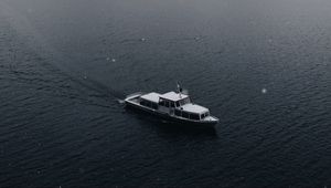 Preview wallpaper boat, sea, fog, rock, snow