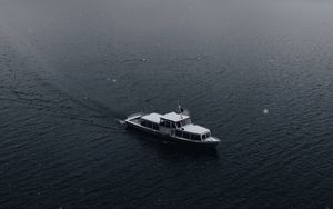 Preview wallpaper boat, sea, fog, rock, snow