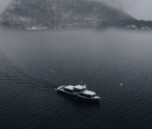 Preview wallpaper boat, sea, fog, rock, snow