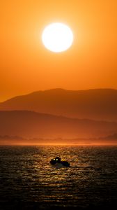 Preview wallpaper boat, sea, hills, silhouettes, sunset