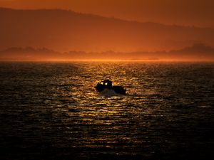 Preview wallpaper boat, sea, hills, silhouettes, sunset