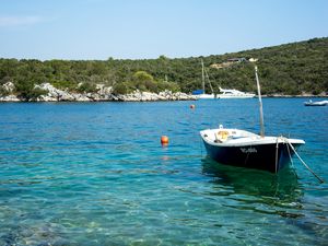 Preview wallpaper boat, sea, trees, bottom, stones