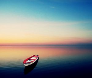 Preview wallpaper boat, sea, water surface, loneliness, night, sunset, skyline