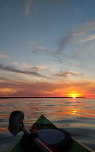 Preview wallpaper boat, sunset, horizon, canoe, sky