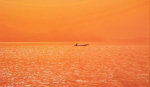 Preview wallpaper boat, sunset, sunlight, red, lake, ripples